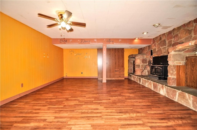 306 Barbara Dr, Carroll Twp, PA 15063 - unfurnished living room with wood finished floors, a ceiling fan, and wood walls
