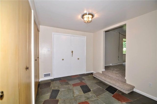 306 Barbara Dr, Carroll Twp, PA 15063 - foyer entrance with stone finish flooring and baseboards