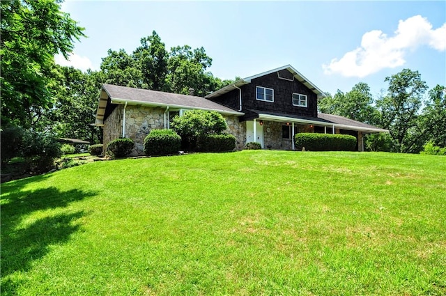 306 Barbara Dr, Carroll Twp, PA 15063 - view of front facade featuring stone siding and a front yard