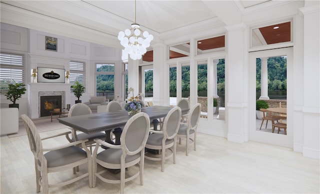 85 1st St, Oakmont, PA 15139 - dining area with a premium fireplace, a chandelier, ornamental molding, and a decorative wall