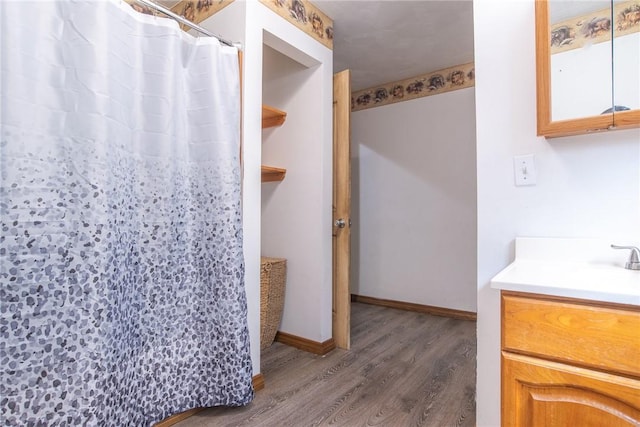 151 Cove Run Rd, Bradys Bend Twp, PA 16028 - full bath with wood finished floors, vanity, and a shower with curtain