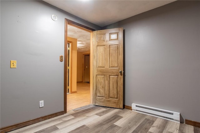 151 Cove Run Rd, Bradys Bend Twp, PA 16028 - spare room featuring baseboard heating and light wood-style floors