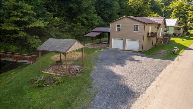 151 Cove Run Rd, Bradys Bend Twp, PA 16028 - view of home's exterior featuring driveway, an attached garage, a yard, and a carport