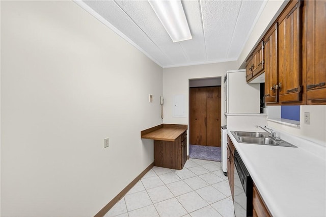 820 E Beau St Unit Tlc, South Strabane, PA 15301 - kitchen with a textured ceiling, ornamental molding, light countertops, light tile patterned floors, and brown cabinetry