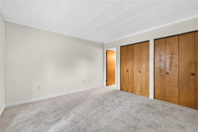 820 E Beau St Unit Tlc, South Strabane, PA 15301 - unfurnished bedroom with carpet floors, two closets, and crown molding