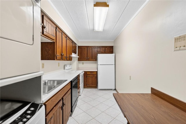 820 E Beau St Unit Tlc, South Strabane, PA 15301 - kitchen with white appliances, light countertops, washer / clothes dryer, light tile patterned floors, and brown cabinetry