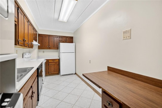 820 E Beau St Unit Tlc, South Strabane, PA 15301 - kitchen with freestanding refrigerator, electric range, brown cabinetry, light countertops, and a textured ceiling