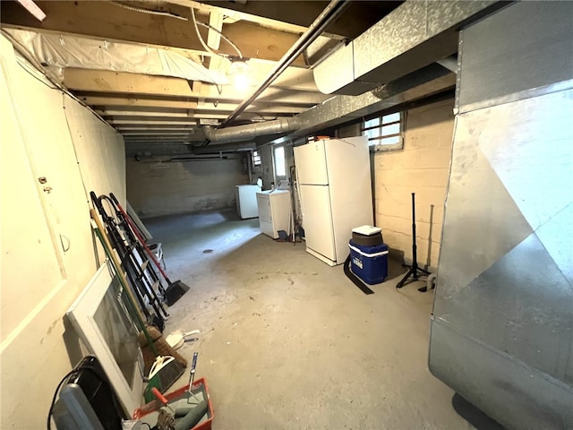 7351/2 7th Ave, Coraopolis, PA 15108 - basement with freestanding refrigerator, heating unit, and washer / clothes dryer