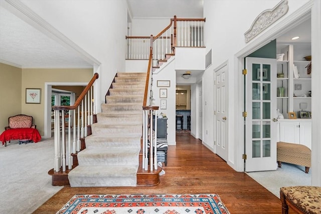 2001 Buckingham Dr, Marshall, PA 16046 - foyer entrance with stairway, crown molding, wood finished floors, a towering ceiling, and carpet floors