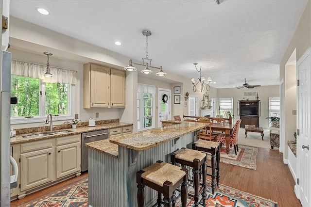 2001 Buckingham Dr, Marshall, PA 16046 - kitchen with healthy amount of natural light, ceiling fan, a center island, light stone counters, and recessed lighting