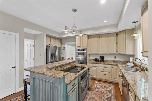 2001 Buckingham Dr, Marshall, PA 16046 - kitchen with wood finished floors, stainless steel appliances, a center island, light stone countertops, and pendant lighting