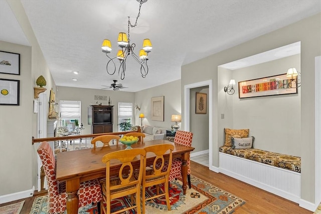 2001 Buckingham Dr, Marshall, PA 16046 - dining area featuring a chandelier, wood finished floors, and a ceiling fan