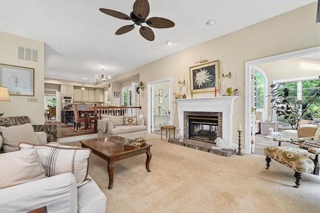 2001 Buckingham Dr, Marshall, PA 16046 - living room with a ceiling fan, light carpet, a brick fireplace, and a chandelier