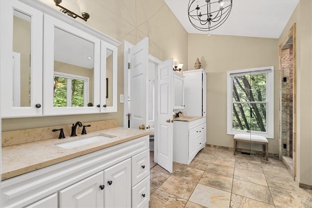 2001 Buckingham Dr, Marshall, PA 16046 - bathroom featuring a chandelier, plenty of natural light, two vanities, lofted ceiling, and a shower with shower door