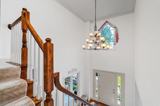2001 Buckingham Dr, Marshall, PA 16046 - foyer entrance with a chandelier, ornamental molding, stairway, plenty of natural light, and wood finished floors