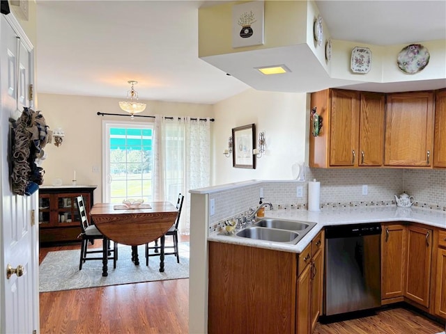 195 Rural Ave, South Strabane, PA 15301 - kitchen with brown cabinets, wood finished floors, dishwasher, and light countertops