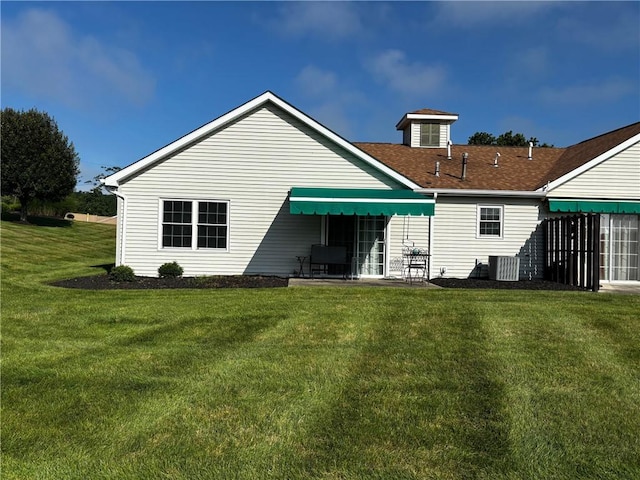 195 Rural Ave, South Strabane, PA 15301 - back of property with a lawn and a patio area