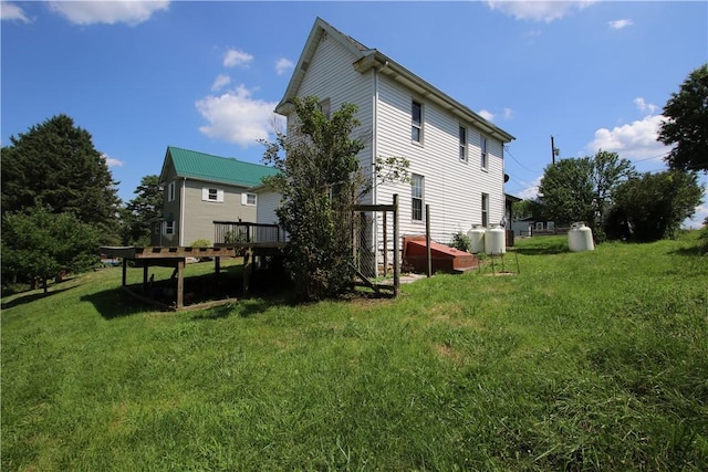 431 1st Ave, Luzerne Twp, PA 15413 - rear view of house featuring a deck and a lawn