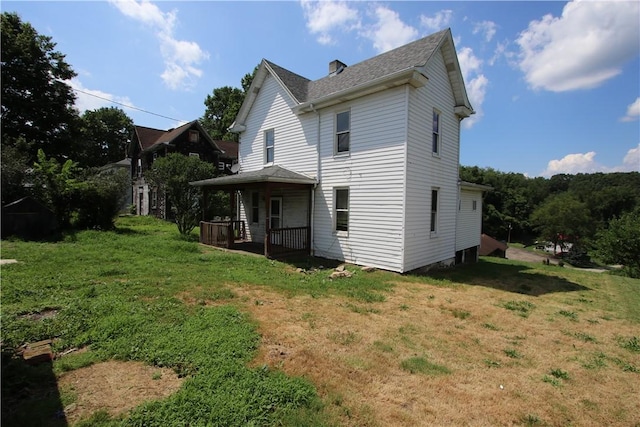 431 1st Ave, Luzerne Twp, PA 15413 - rear view of house featuring a lawn, covered porch, and roof with shingles