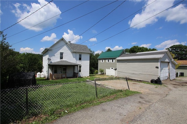 431 1st Ave, Luzerne Twp, PA 15413 - view of front of home featuring a detached garage and an outbuilding
