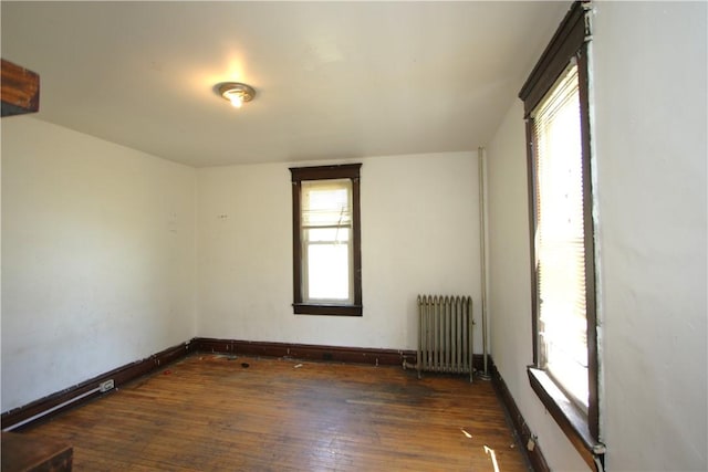 431 1st Ave, Luzerne Twp, PA 15413 - unfurnished room with radiator heating unit and hardwood / wood-style floors