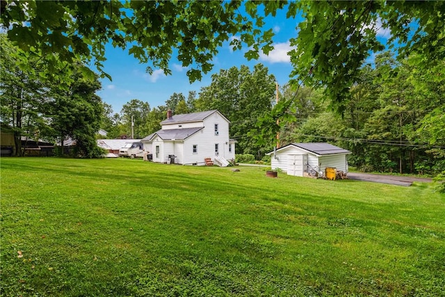 136 B St, Shade Twp, PA 15563 - view of grassy yard featuring a storage unit and driveway