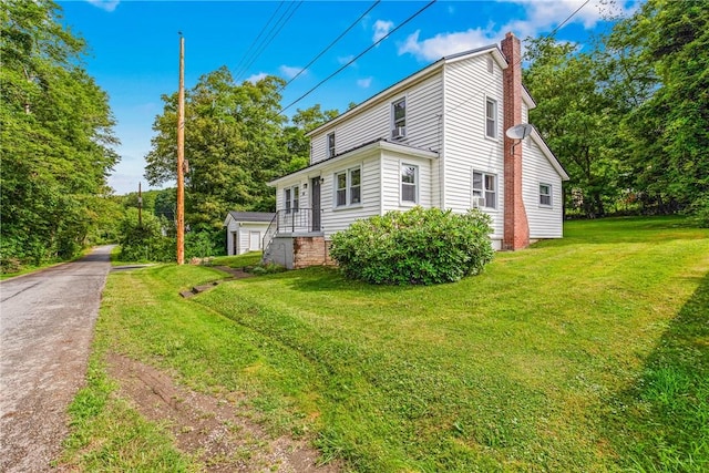 136 B St, Shade Twp, PA 15563 - view of side of property with a chimney and a yard