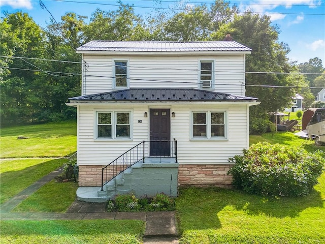 136 B St, Shade Twp, PA 15563 - view of front facade with a metal roof, a front lawn, and a chimney