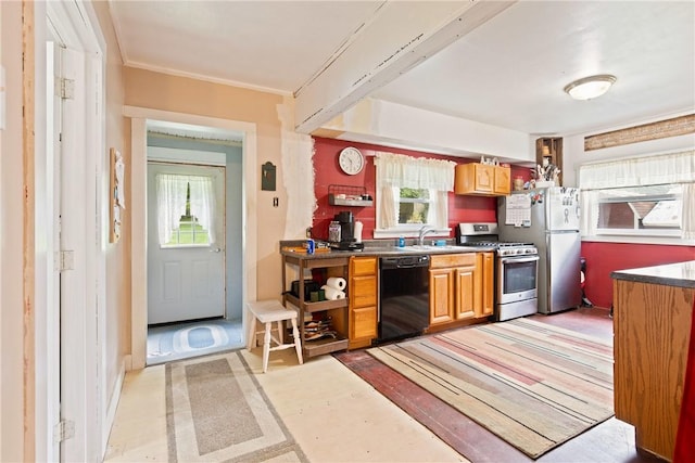 136 B St, Shade Twp, PA 15563 - kitchen with gas stove, plenty of natural light, black dishwasher, dark countertops, and crown molding