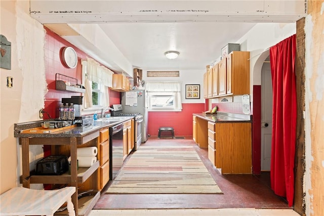 136 B St, Shade Twp, PA 15563 - kitchen with open shelves, gas range, black dishwasher, arched walkways, and brown cabinetry