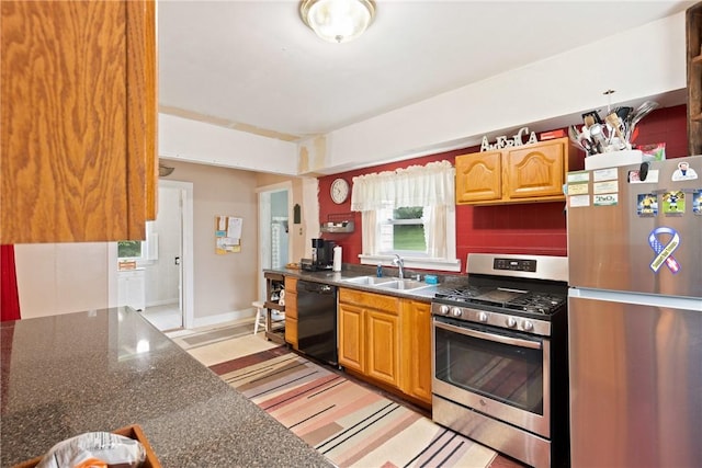136 B St, Shade Twp, PA 15563 - kitchen featuring freestanding refrigerator, stainless steel gas range, dark countertops, and dishwasher