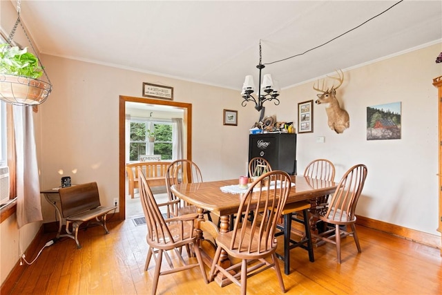 136 B St, Shade Twp, PA 15563 - dining room with light wood-style floors, ornamental molding, and a chandelier