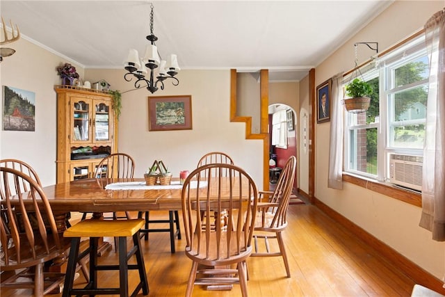 136 B St, Shade Twp, PA 15563 - dining area with ornamental molding, plenty of natural light, a chandelier, and light wood-type flooring