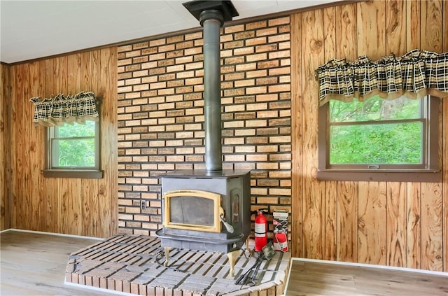 1405 Three Degree Rd, Adams Twp, PA 16059 - detailed view of a wood stove, wooden walls, and wood finished floors