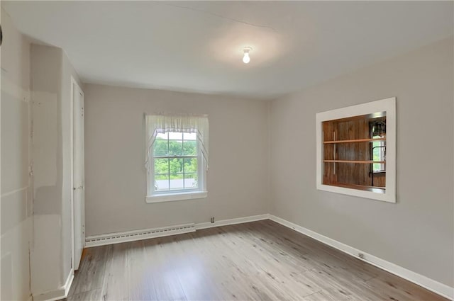 1405 Three Degree Rd, Adams Twp, PA 16059 - empty room with wood finished floors and baseboard heating