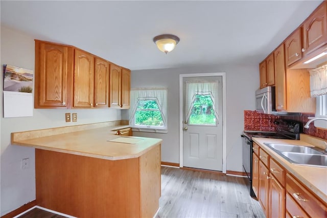 1405 Three Degree Rd, Adams Twp, PA 16059 - kitchen featuring black electric range, light wood-type flooring, and light countertops