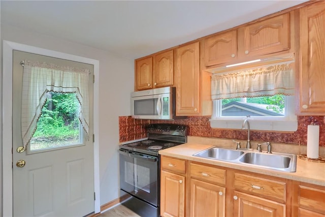 1405 Three Degree Rd, Adams Twp, PA 16059 - kitchen with black / electric stove, stainless steel microwave, backsplash, and light countertops