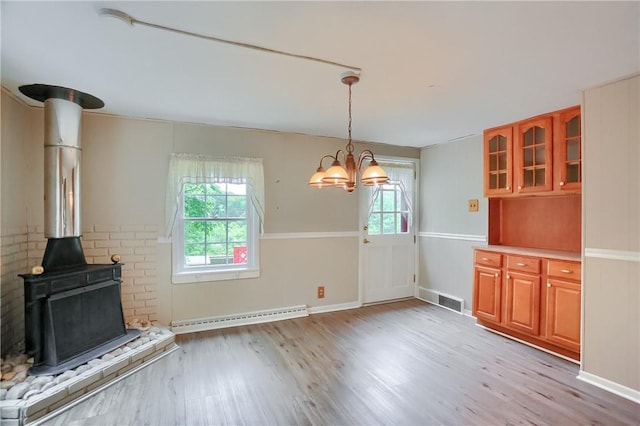 1405 Three Degree Rd, Adams Twp, PA 16059 - unfurnished dining area with light wood-style flooring, a chandelier, and a baseboard heating unit