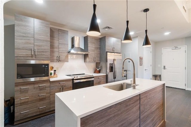 2545 Penn Ave Unit 208, Downtown Pgh, PA 15222 - kitchen with stainless steel appliances, dark wood-style flooring, wall chimney exhaust hood, light countertops, and backsplash