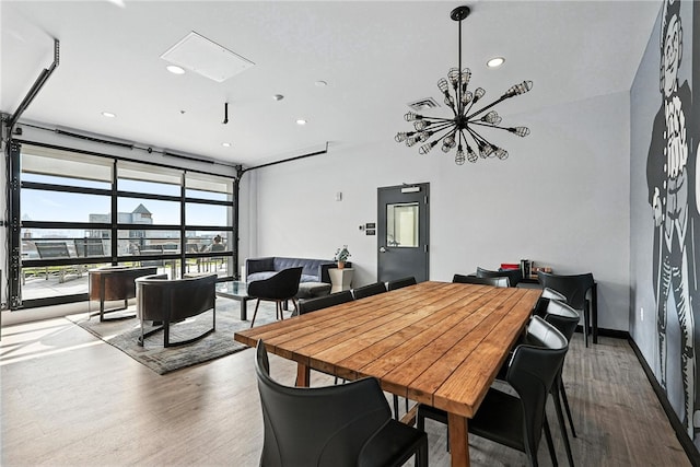 2545 Penn Ave Unit 208, Downtown Pgh, PA 15222 - dining area featuring wood finished floors, recessed lighting, and floor to ceiling windows