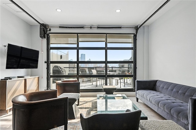2545 Penn Ave Unit 208, Downtown Pgh, PA 15222 - living room with wood finished floors, healthy amount of natural light, and recessed lighting