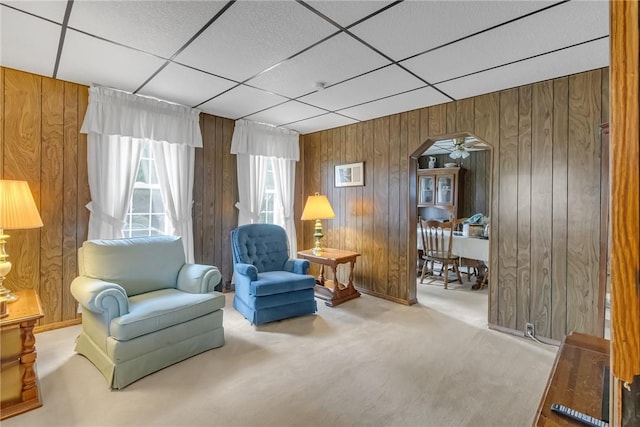 122 S Atlantic Ave, Cheswick, PA 15024 - sitting room featuring carpet floors, wood walls, a drop ceiling, arched walkways, and ceiling fan
