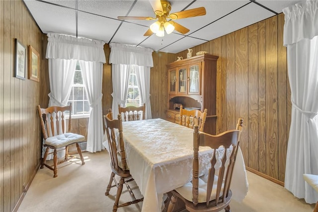 122 S Atlantic Ave, Cheswick, PA 15024 - dining area featuring wooden walls, light carpet, and ceiling fan
