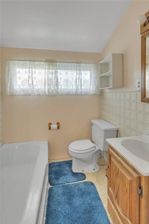 122 S Atlantic Ave, Cheswick, PA 15024 - full bath with healthy amount of natural light, a tub, vanity, tile walls, and lofted ceiling