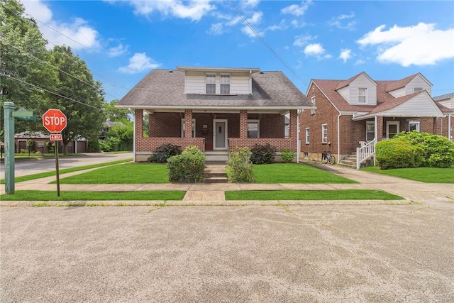 122 S Atlantic Ave, Cheswick, PA 15024 - bungalow-style home featuring brick siding, covered porch, and a front yard