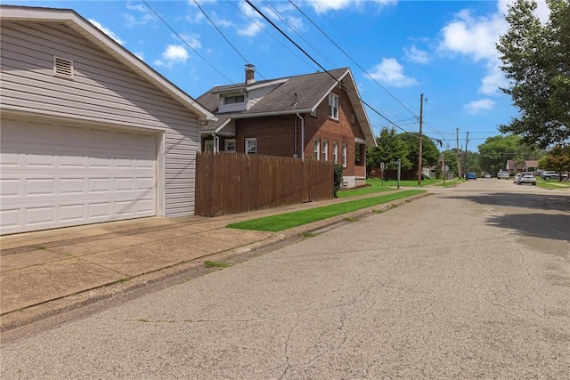 122 S Atlantic Ave, Cheswick, PA 15024 - view of side of property featuring a garage, driveway, and brick siding