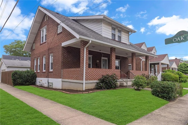 122 S Atlantic Ave, Cheswick, PA 15024 - view of front of house with brick siding, roof with shingles, and covered porch