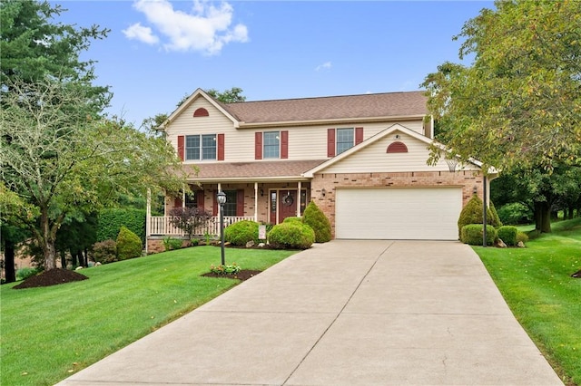 103 Cool Springs Ln, Penn Twp, PA 15636 - view of front of house featuring concrete driveway, brick siding, an attached garage, covered porch, and a front lawn