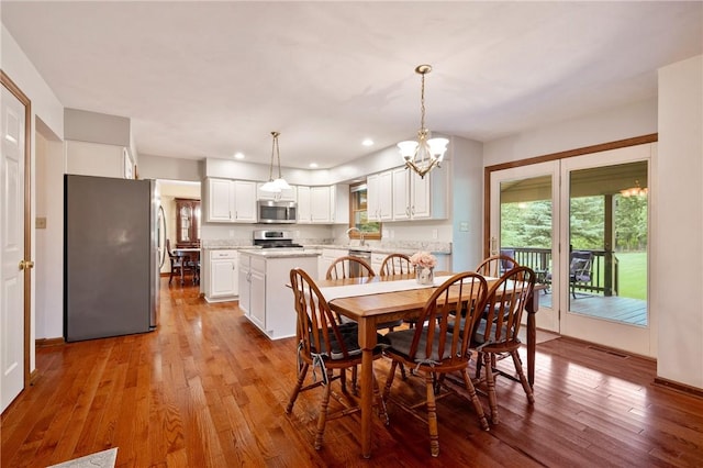 103 Cool Springs Ln, Penn Twp, PA 15636 - dining room featuring light wood-style floors, a chandelier, and recessed lighting