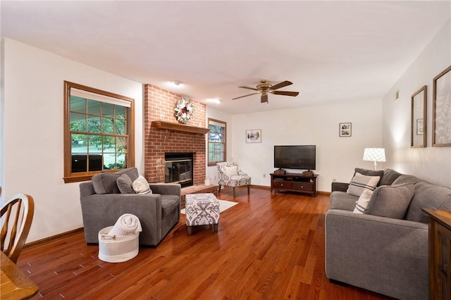 103 Cool Springs Ln, Penn Twp, PA 15636 - living area featuring wood finished floors, healthy amount of natural light, and a fireplace